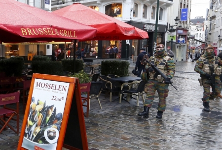 Belgian soldiers patrol nearby Brussels' Grand Place on November 22, 2015, after security was tightened in Belgium following the fatal attacks in Paris. Belgium widened its search on Sunday for armed Islamist extremists whose presence has put Brussels on maximum alert, with officials saying more than one militant was at large in the city.