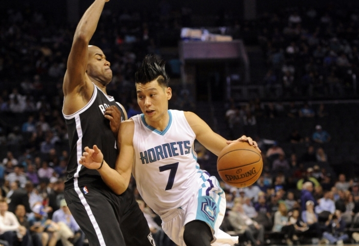 Charlotte Hornets guard Jeremy Lin (7) drives past Brooklyn Nets guard Jarrett Jack (2) during the first half of the game at Time Warner Cable Arena in Charlotte, North Carolina on Nov 18, 2015.