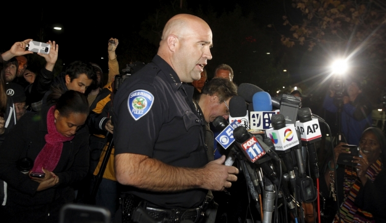 San Bernardino Police Chief Jarrod Burguan (C) speaks at a news conferenece, informing the media, that the couple Syed Rizwan Farook, 28, and Tashfeen Malik, 27, were responsible for the shooting rampage at the Inland Regional Center, in San Bernardino, California December 2, 2015. Farook and Malik were later killed in a shootout with police in San Bernardino.