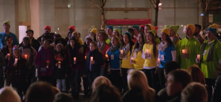 A commercial from Microsoft wherein employees and a child choir sing the song 'Let There Be Peace on Earth' to Apple employees, omitting the line 'With God as our Father.'