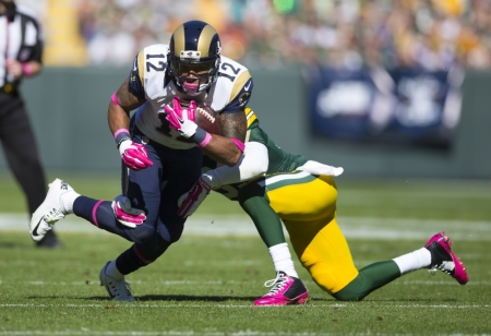 St. Louis Rams wide receiver Stedman Bailey (12) rushes with the football as Green Bay Packers safety Micah Hyde (33) defends during the second quarter at Lambeau Field, Green Bay, Wisconsin, on October 11, 2015.