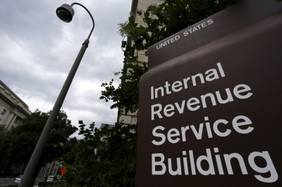 A security camera hangs near a corner of the U.S. Internal Revenue Service building in Washington, May 27, 2015.