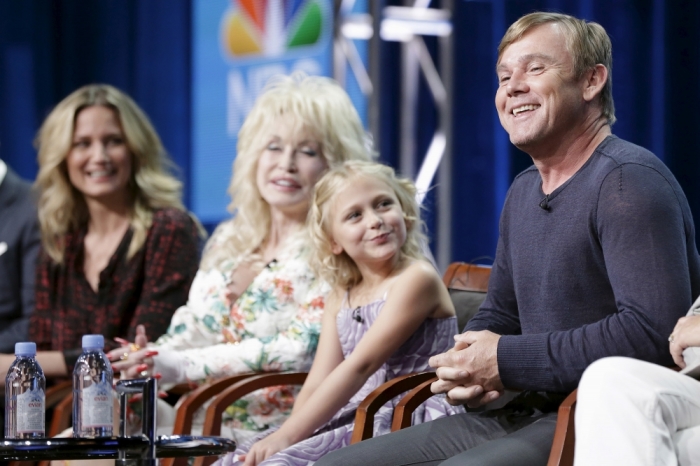 (L to R) Cast member Jennifer Nettles, executive producer Dolly Parton, and cast members Alyvia Lind, andparticipate in the NBCUniversal 'Dolly Parton's Coat of Many Colors' panel at the Television Critics Association Summer 2015 Press Tour in Beverly Hills, California, August 13, 2015.