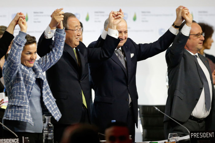 From L-R, Christiana Figueres, Executive Secretary of the UN Framework Convention on Climate Change, United Nations Secretary-General Ban Ki-moon, French Foreign Affairs Minister Laurent Fabius, President-designate of COP21 and French President Francois Hollande react during the final plenary session at the World Climate Change Conference 2015 (COP21) at Le Bourget, near Paris, France, December 12, 2015.