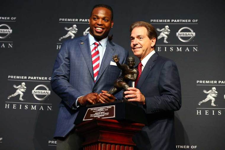 Alabama running back Derrick Henry (left) and head coach Nick Saban pose with the Heisman Trophy during a press conference at the New York Marriott Marquis after the 81st annual Heisman Trophy presentation.