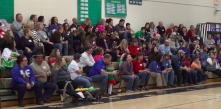 Audience members recite a Bible verse during the production of 'A Charlie Brown Christmas' at Johnson County Schools in Kentucky on December 17, 2015.