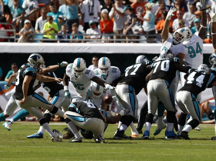 Nov 24, 2013; Miami Gardens, FL, USA; Carolina Panthers kicker Graham Gano (9) has his kick blocked in the first quarter of a game against the Miami Dolphins at Sun Life Stadium.