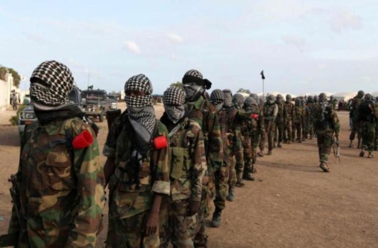 Members of al Shabaab parade at Ala Yaasir camp, outside of Somalia's capital Mogadishu, September 3, 2011.