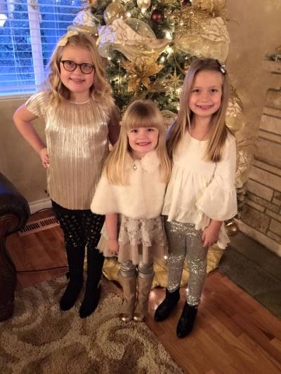 Twins Grace, Isabella and Sadie (the middle) pose for mother Natalie Grant's social media post