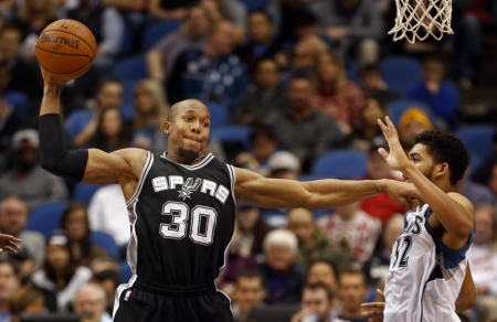 San Antonio Spurs forward David West (30) works for position around Minnesota Timberwolves center Karl-Anthony Towns (32) in the first quarter at Target Center, Minneapolis, Minnesota, December 23, 2015.