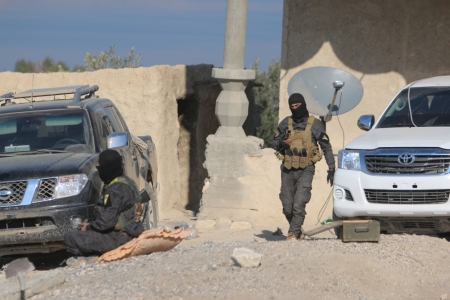 Kurdish fighters from the People's Protection Units, who are fighting alongside with the Democratic Forces of Syria, are seen at the eastern entrance of the the Tishrin dam, after they captured it on Saturday from Islamic State militants, south of Kobani, Syria, December 27, 2015. A U.S.-backed alliance of Syrian Kurds and Arab rebel groups, supported by U.S. coalition planes, captured a dam on Saturday from Islamic State, cutting one of its main supply routes across the Euphrates, an alliance spokesman said.