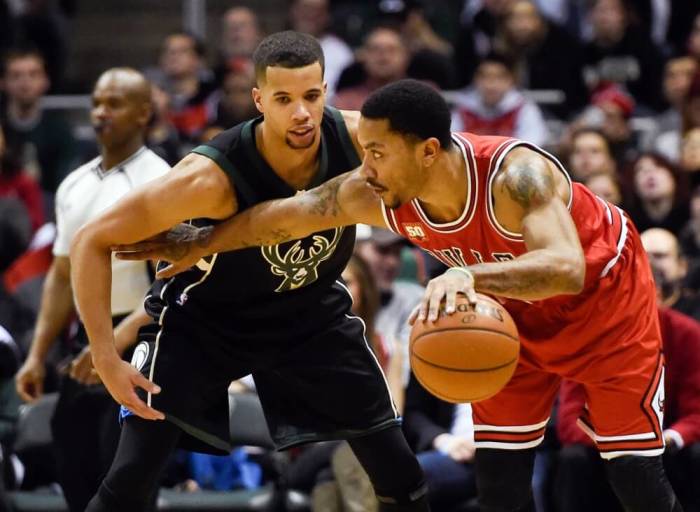 Chicago Bulls guard Derrick Rose (1) tries to get around Milwaukee Bucks guard Michael Carter-Williams (5) in the second quarter at BMO Harris Bradley Center in Milwaukee, Wisconsin, January 12, 2016.