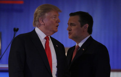 Republican U.S. presidential candidate businessman Donald Trump and rival candidate Senator Ted Cruz (R) cross paths during a break at the Fox Business Network Republican presidential candidates debate in North Charleston, South Carolina, January 14, 2016.