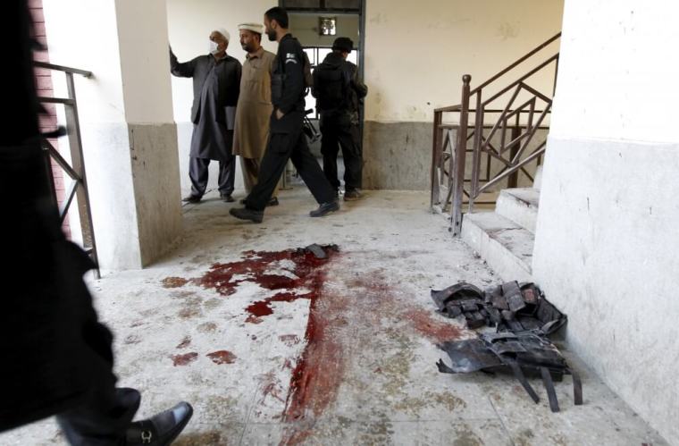 Blood stains and flak jackets used by attackers remain in the hallway of a dormitory where a militant attack took place, at Bacha Khan University in Charsadda, Pakistan, January 20, 2016.