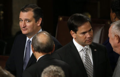 Republican U.S. presidential candidate and Senator Ted Cruz (L) looks over at rival candidate Senator Marco Rubio (2nd R) after Pope Francis' address before a joint meeting of the U.S. Congress in the House of Representatives Chamber on Capitol Hill in Washington September 24, 2015.