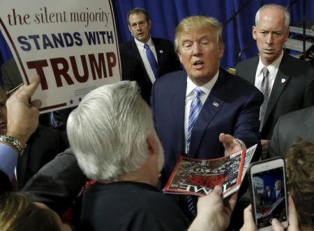 U.S. Republican presidential candidate Donald Trump greets attendees at a campaign event in Muscatine, Iowa, United States, January 24, 2016.