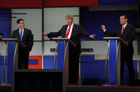 Republican U.S. presidential candidate businessman Donald Trump gestures towards rivals Senator Marco Rubio (L) and Senator Ted Cruz (R) during the Fox Business Network Republican presidential candidates debate in North Charleston, South Carolina, January 14, 2016.