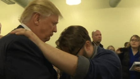 A pastor from the First Christian Orchard Church in Council Bluffs, Iowa, prays for Republican presidential frontrunner, Donald Trump.