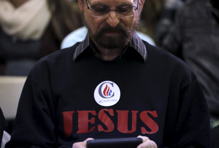 A supporter of U.S. Republican presidential candidate Ted Cruz attends a campaign event in Iowa City, Iowa, United States, January 31, 2016.