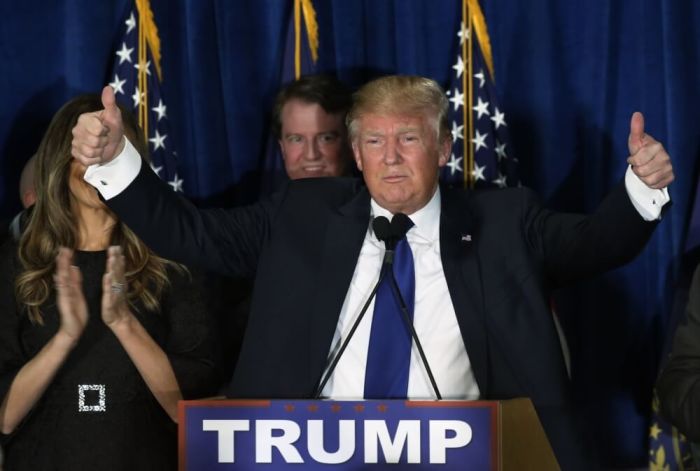 Republican U.S. presidential candidate Donald Trump reacts at his 2016 New Hampshire presidential primary night rally in Manchester, New Hampshire February 9, 2016.