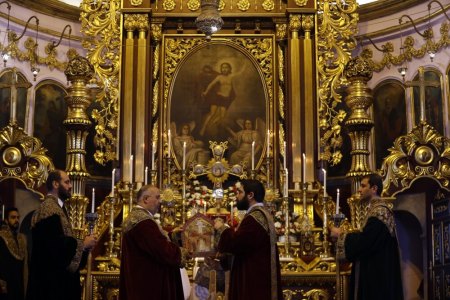 Priests hold a mass at Surp Asdvadzadzin Patriarchal Church in Istanbul, Turkey, April 24, 2015, as part of events to commemorate the victims of mass killings of Armenians by Ottoman Turks.