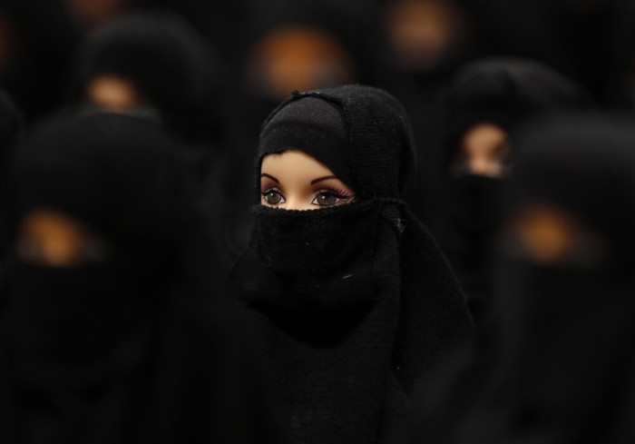 The installation 'Sheltered position' of German artist Sabine Reyer shows one hundred Barbie dolls dressed with burkas at the Ruhr-Biennale in Dortmund, Germany, October 7, 2012.