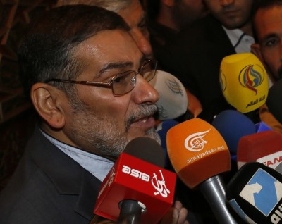 Admiral Ali Shamkhani, Iran's Supreme National Security Council Director, speaks to the media after his arrival at Damascus airport, September 30, 2014.