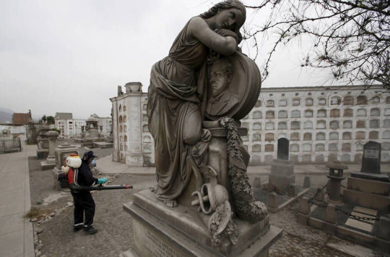 A health worker fumigates as part of preventive measures against the Zika virus and other mosquito-borne diseases, at the cemetery of Presbitero Maestro in Lima, Peru, February 12, 2016.