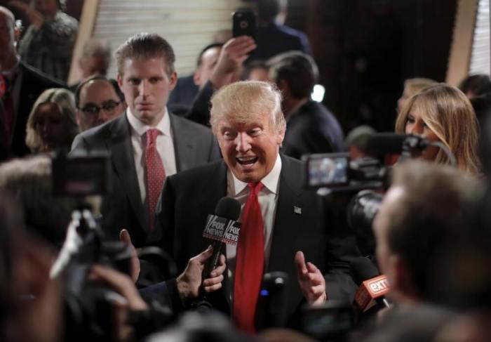 U.S. Republican presidential candidate Donald Trump speaks with the media in the spin room after the Republican U.S. candidates debate sponsored by CBS News and the Republican National Committee in Greenville, South Carolina, February 13, 2016.