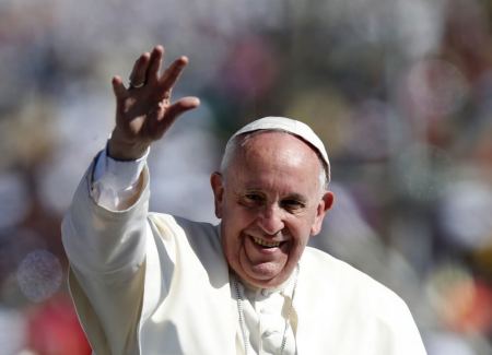 Pope Francis waves to the crowd while arriving to celebrate Mass in San Cristobal de las Casas, February 15, 2016.