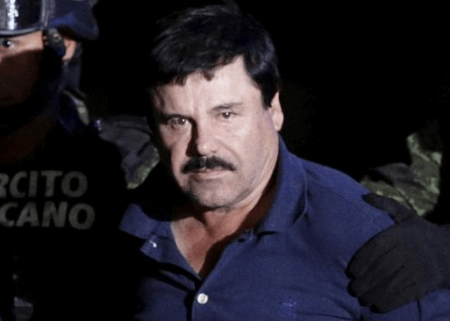 Recaptured drug lord Joaquin 'El Chapo' Guzman is escorted by soldiers