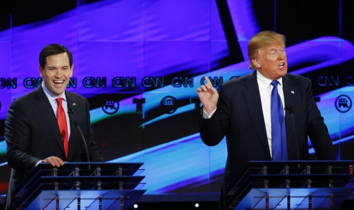 Republican U.S. presidential candidate Marco Rubio laughs at rival Donald Trump (R) during the debate sponsored by CNN for the 2016 Republican U.S. presidential candidates in Houston, Texas, February 25, 2016.