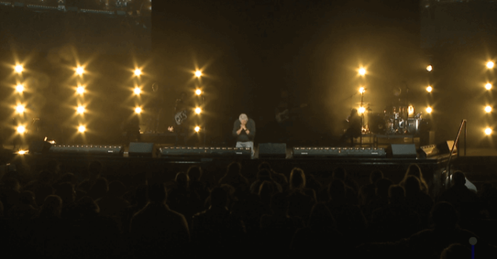 Pastor Louie Giglio kneels in prayer after speaking to audiences at the Catalyst West conference at Mariners Church, Orange County, California, March 4, 2016.