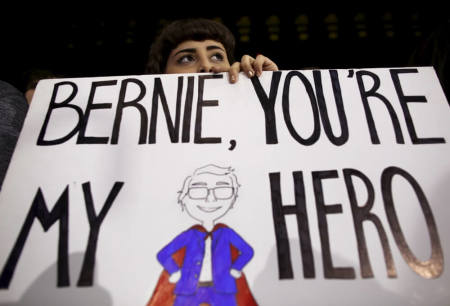 A supporter listens to U.S. Democratic presidential candidate Bernie Sanders at a campaign rally in Ann Arbor, Michigan, March 7, 2016.