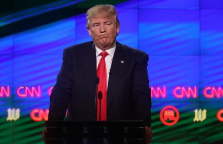 Republican U.S. presidential candidate Donald Trump reacts during the Republican candidates debate sponsored by CNN at the University of Miami in Miami, Florida, March 10, 2016.