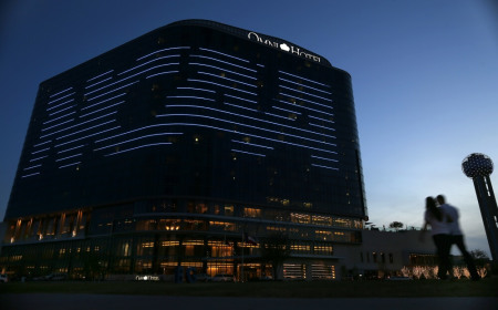 The NCAA logo is seen on the side of a hotel in Dallas, Texas, March 30, 2013.