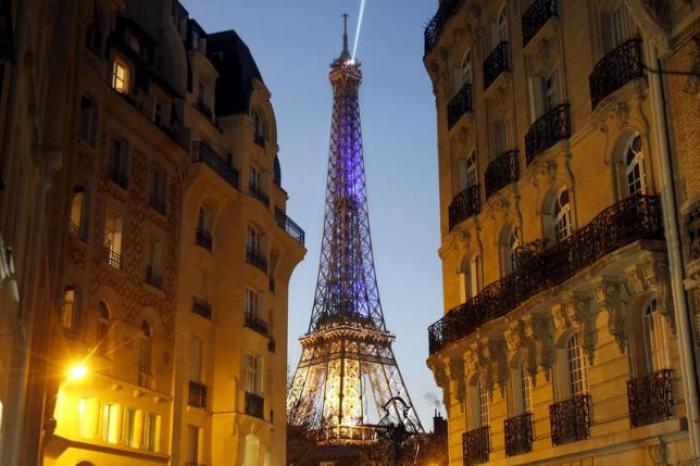 The Eiffel Tower is seen at night in Paris, France, November 23, 2015.