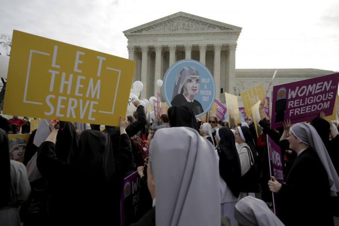 Nuns rally before Zubik v. Burwell, an appeal brought by Christian groups demanding full exemption from the requirement to provide insurance covering contraception under the Affordable Care Act, is heard by the U.S. Supreme Court in Washington, March 23, 2016.