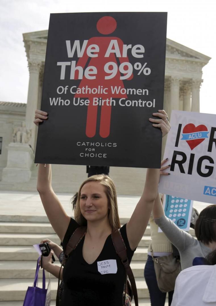 Supporters of contraception rally before Zubik v. Burwell, an appeal brought by Christian groups demanding full exemption from the requirement to provide insurance covering contraception under the Affordable Care Act, is heard by the U.S. Supreme Court in Washington March 23, 2016.