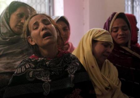 Family members mourn the death of a relative, who was killed in a blast that happened outside a public park on Sunday, in Lahore, Pakistan, March 28, 2016.