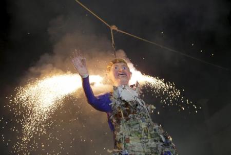 Mexicans burn an effigy of U.S. Republican presidential hopeful Donald Trump as they celebrate an Easter ritual late on Saturday in Mexico City's poor La Merced neighborhood March 26, 2016.