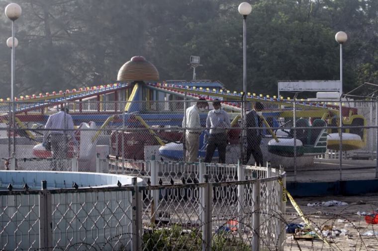 Forensic officers look for evidence at the site of a blast that happened outside a public park on Sunday, in Lahore, Pakistan, March 28, 2016.