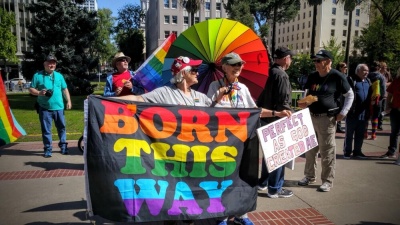 LGBT activists protest outside California's state capitol building in Sacramento while leading evangelist Franklin Graham holds a prayer rally on March 31, 2016.