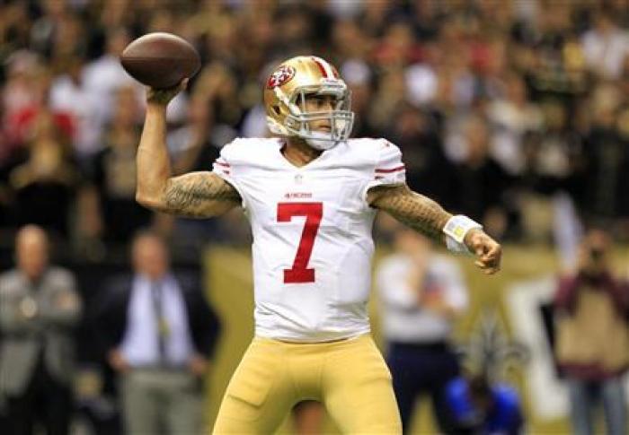 Quarterback Colin Kaepernick of the San Francisco 49ers drops back in preparation for a pass in a game against the New Orleans Saints.