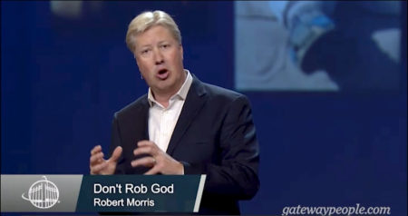 Pastor Robert Morris speaking to his congregation about tithes.