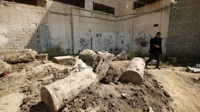 A man walks past ancient ruins which archaeologists say may be part of a Byzantine church or cathedral dating from around 1,500 years ago, in Gaza City April 4, 2016.