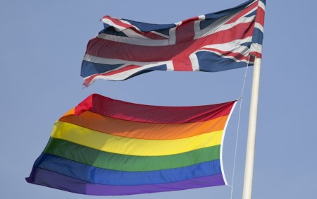 A rainbow flag flies with the Union flag above British Cabinet Offices, marking the first day Britain has allowed same sex marriages, in London March 29, 2014. Prime Minister David Cameron hailed Britain's first gay marriages on Saturday, saying marriage was not something that should be denied to anyone because of their sexuality. Campaigners have spent years battling to end a distinction that many gay couples say made them feel like second class citizens and Saturday was the first day that gay couples could tie the knot in England and Wales.