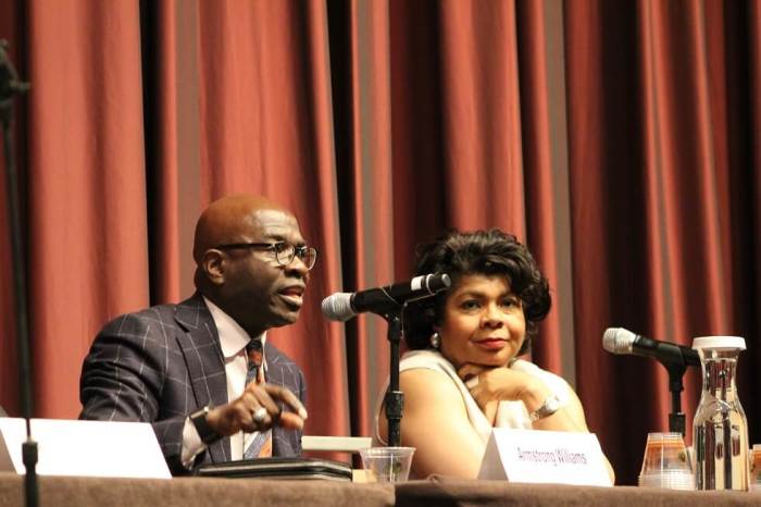 Armstrong Williams (L) confidante of retired neurosurgeon Ben Carson tries to make a point to a rowdy crowd at Al Sharpton's National Action Network Convention in New York City on Wednesday April 13, 2016. April Ryan (R), White House correspondent for American Urban Radio Network looks on.