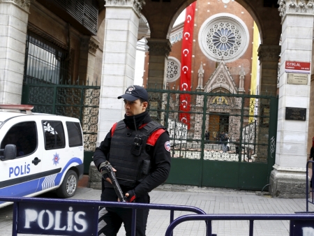 A Turkish police officer stands guard in front of St. Antouan Church at Istiklal Street in Istanbul, Turkey, March 27, 2016.