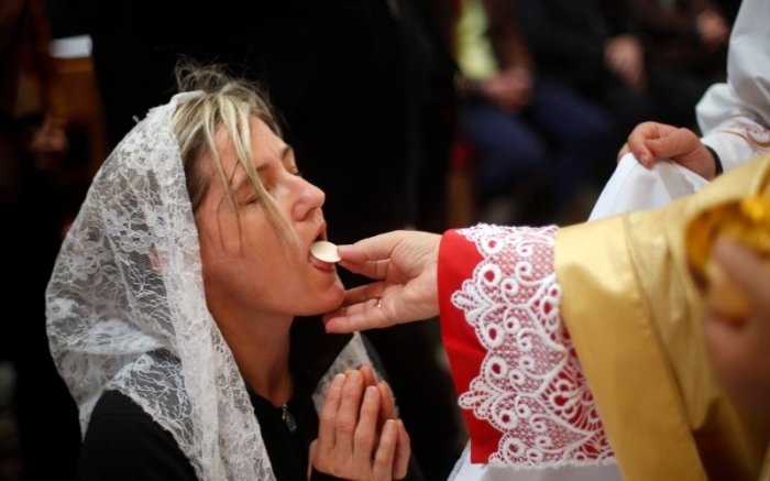 Woman receiving Holy Communion in a Catholic church in this undated photo.